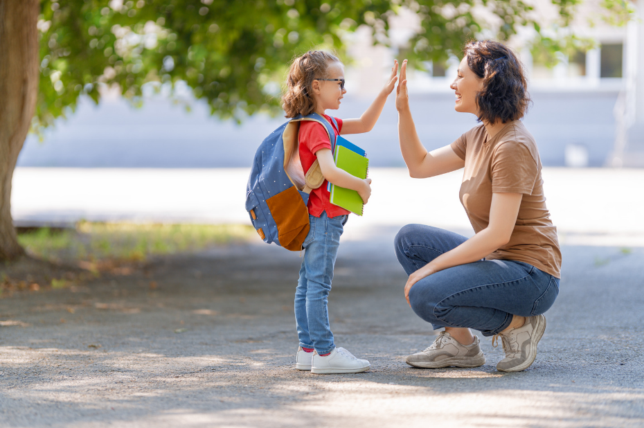 Parent and child high fiving 